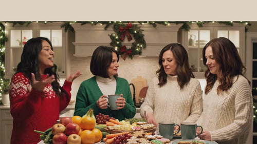 4 Women in enjoying holiday season in a kitchen setting